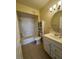 Cozy bathroom featuring a toilet, vanity, and shower over tub combo at 7159 S Durango Dr # 206, Las Vegas, NV 89113