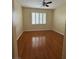 Bedroom with hardwood floors and a large window at 7159 S Durango Dr # 206, Las Vegas, NV 89113