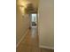 Hallway leading to the bathroom featuring tile floor and neutral paint throughout at 7159 S Durango Dr # 206, Las Vegas, NV 89113