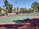 Outdoor tennis court for active living, surrounded by green trees and blue skies at 7159 S Durango Dr # 206, Las Vegas, NV 89113