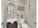 Bright half bathroom features traditional fixtures and decor at 7310 Heggie Ave, Las Vegas, NV 89131