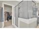 Shower stall with glass enclosure and view into walk-in closet at 7310 Heggie Ave, Las Vegas, NV 89131
