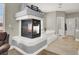 Spacious bathroom with a fireplace, soaking tub, and wood floors at 7310 Heggie Ave, Las Vegas, NV 89131