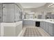 Elegant bathroom featuring double sinks, a glass shower, and modern fixtures at 7310 Heggie Ave, Las Vegas, NV 89131