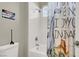 Bathroom featuring a shower/tub combo with a dinosaur themed shower curtain at 7310 Heggie Ave, Las Vegas, NV 89131