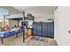 Bedroom with a bunk bed, storage drawers, and neutral wall colors at 7310 Heggie Ave, Las Vegas, NV 89131