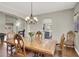 Charming dining area with hardwood floors and an open view into the kitchen at 7310 Heggie Ave, Las Vegas, NV 89131