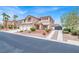 Beautiful two-story home with meticulously landscaped front yard and a two-car garage at 7310 Heggie Ave, Las Vegas, NV 89131