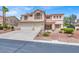 Stunning two-story home featuring a tile roof, balcony, and a two-car garage at 7310 Heggie Ave, Las Vegas, NV 89131