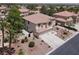 Aerial view of the two-story home with a tile roof and three-car garage at 7310 Heggie Ave, Las Vegas, NV 89131