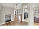 Open foyer showcasing wood floors, grand staircase, whimsical play area, and access to laundry at 7310 Heggie Ave, Las Vegas, NV 89131