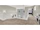 Hallway with white railing offers a view of the downstairs and a bedroom with barn door at 7310 Heggie Ave, Las Vegas, NV 89131