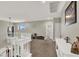 Upstairs hallway featuring white railings and trim, leading to various rooms at 7310 Heggie Ave, Las Vegas, NV 89131
