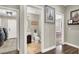 Hallway with laundry room, half bathroom, and bedroom visible at 7310 Heggie Ave, Las Vegas, NV 89131