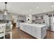 A kitchen with grey cabinets, a large center island and stainless steel appliances at 7310 Heggie Ave, Las Vegas, NV 89131