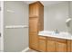 Utility room featuring a sink, cabinet, and storage on an open wall with multiple hooks at 7310 Heggie Ave, Las Vegas, NV 89131