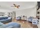 Bright living room with an open floor plan and dark wooden floors with blue furniture at 7310 Heggie Ave, Las Vegas, NV 89131