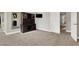 Large living room featuring a desk, shelves, and carpeted flooring at 7310 Heggie Ave, Las Vegas, NV 89131