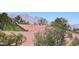 Exterior shot showing the roof and beautiful mountain views at 7310 Heggie Ave, Las Vegas, NV 89131