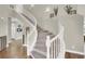 Elegant staircase with white railings and carpeted steps, connecting multiple levels of the home at 7310 Heggie Ave, Las Vegas, NV 89131