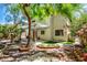 An inviting backyard area featuring mature trees, custom brickwork and a fountain at 7429 Fencerow St, Las Vegas, NV 89131