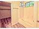 Bathroom with a tub and shower combination, along with stylish wood flooring at 7429 Fencerow St, Las Vegas, NV 89131