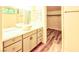 Bright bathroom with bowl sink, modern vanity, and wood look floors for a sleek, contemporary feel at 7429 Fencerow St, Las Vegas, NV 89131