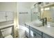 Modern bathroom features a vessel sink, a toilet with built in shelving and a tub with shower at 7429 Fencerow St, Las Vegas, NV 89131