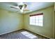 Bedroom with neutral walls, carpet, and large window at 7429 Fencerow St, Las Vegas, NV 89131