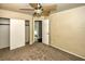 Bedroom with carpet, ceiling fan, and access to a closet and the bathroom at 7429 Fencerow St, Las Vegas, NV 89131