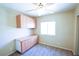 Bedroom offering built-in shelves and drawers, carpet flooring, and a ceiling fan for cooling at 7429 Fencerow St, Las Vegas, NV 89131