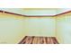 A closet features durable wood-look floors and ample storage with clothing rails at 7429 Fencerow St, Las Vegas, NV 89131