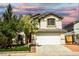 Attractive two-story home with a tidy front lawn, a two-car garage, and a brick-lined driveway at 7429 Fencerow St, Las Vegas, NV 89131