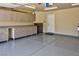 Garage with epoxy flooring, storage cabinets and exterior door at 7429 Fencerow St, Las Vegas, NV 89131