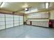 Spacious garage with epoxy flooring, storage cabinets and overhead lighting at 7429 Fencerow St, Las Vegas, NV 89131