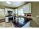 Well-lit kitchen featuring stainless steel appliances, granite countertops, and stylish cabinetry at 7429 Fencerow St, Las Vegas, NV 89131