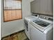 Laundry room featuring a side-by-side washer and dryer and storage cabinets at 7429 Fencerow St, Las Vegas, NV 89131