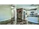 Open-concept living space with unique tile flooring, modern kitchen, and ample natural light at 7429 Fencerow St, Las Vegas, NV 89131