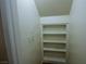 A built in storage area features multiple shelves, offering practical organization at 7429 Fencerow St, Las Vegas, NV 89131
