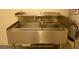 Stainless steel utility sink perfect for cleaning up in the garage at 7429 Fencerow St, Las Vegas, NV 89131