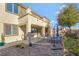 This backyard boasts a covered patio, barbecue, a dining set, and a manicured garden at 7778 Villa Montara St, Las Vegas, NV 89123