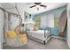 Cozy bedroom with a single bed, unique artwork, and natural light at 7778 Villa Montara St, Las Vegas, NV 89123