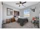 This comfortable bedroom features a ceiling fan and natural lighting at 7778 Villa Montara St, Las Vegas, NV 89123