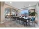 Open-concept dining room connected to the living room with large table for Gathering and friends at 7778 Villa Montara St, Las Vegas, NV 89123
