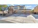 Attractive two-story home with a stone-accented facade and a spacious three-car garage at 7778 Villa Montara St, Las Vegas, NV 89123