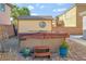 Backyard showcasing a hot tub with tiled patio, and a storage shed at 7778 Villa Montara St, Las Vegas, NV 89123