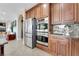Kitchen area featuring stainless steel appliances and sleek cabinetry, offering a modern design at 7778 Villa Montara St, Las Vegas, NV 89123