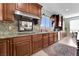 Beautiful kitchen with granite countertops, stainless steel appliances, and decorative backsplash at 7778 Villa Montara St, Las Vegas, NV 89123