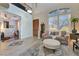 Living room features comfortable seating and leads to an open floor plan with a dining area at 7778 Villa Montara St, Las Vegas, NV 89123