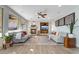 Inviting living room with a fireplace, comfortable seating, and stylish decor at 7778 Villa Montara St, Las Vegas, NV 89123